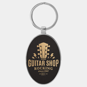Personalized 3" x 1 3/4" Laserable Leatherette/Metal Black/Gold Oval Keychain Thumbnail